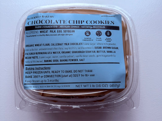 Four frozen brown butter milk chocolate chip cookies from SuperSlo Bakery, showcasing golden-brown cookies with chocolate chips.