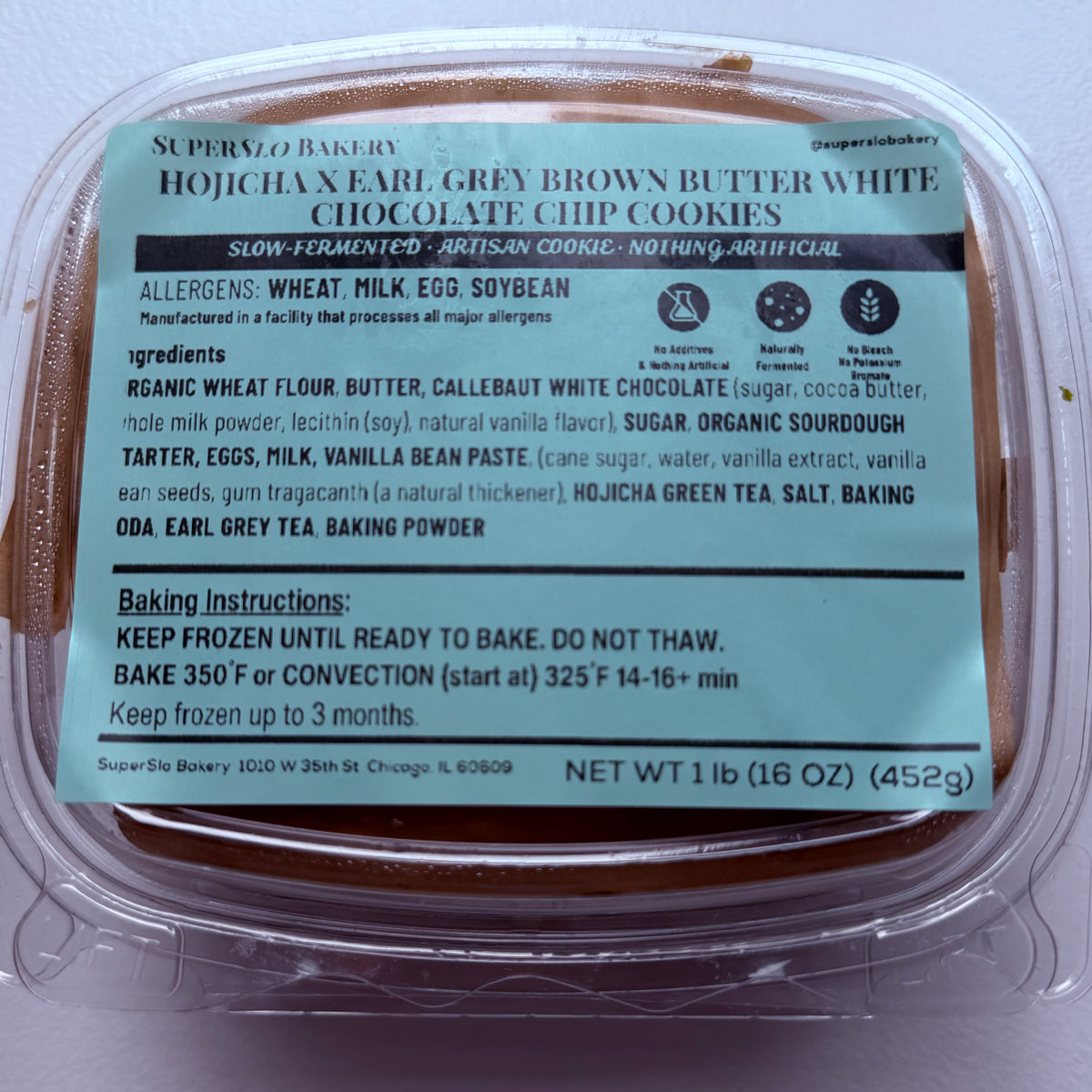 Four frozen cookies with brown butter, white chocolate chips, flavored with Hojicha and Earl Grey, from SuperSlo Bakery.